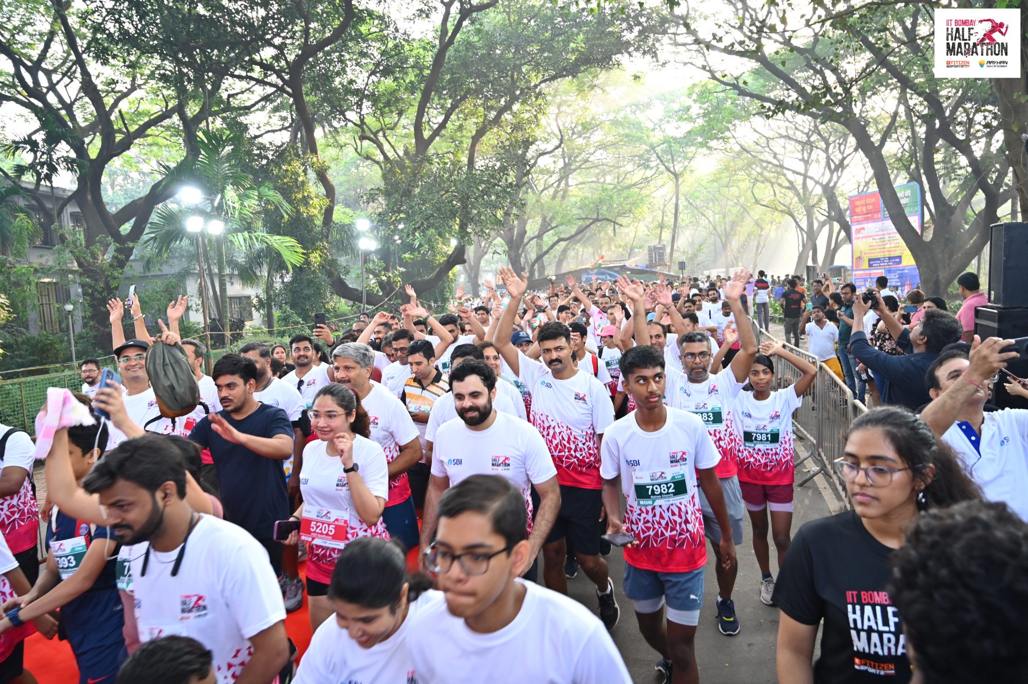 Runners streaming through the tree-lined IIT Bombay campus